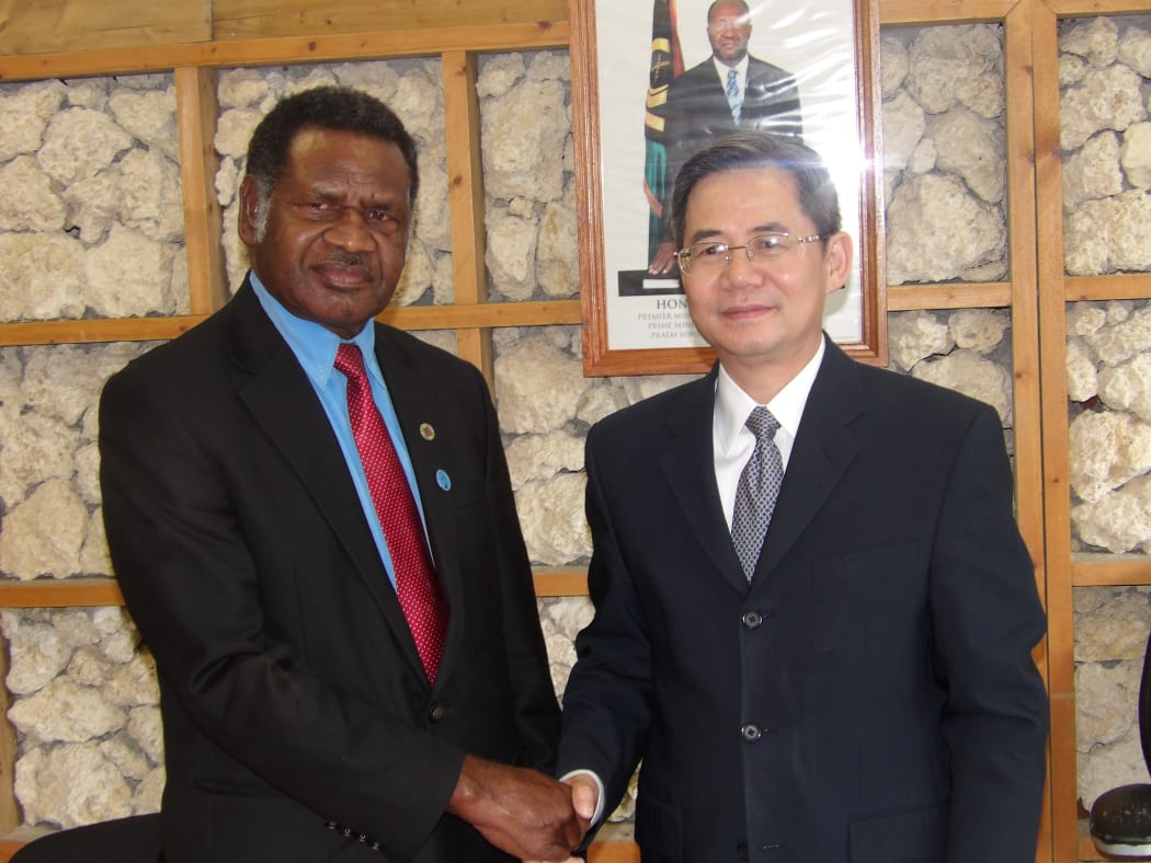 China's Vice Foreign Minister Zheng Zeguang with Ham Lini
