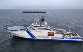 This handout picture released by The Finnish Border Guard on December 26, 2024 shows a Finnish Border Guard's ship Turva (front) and the oil tanker Eagle S on the sea near Porkkalanniemi. - Finnish authorities said on December 26, 2024 that they were investigating an oil tanker that sailed from a Russian port for the "sabotage" of a power cable linking Finland and Estonia that was damaged the previous day. (Photo by Handout / Finnish Border Guard / AFP) / RESTRICTED TO EDITORIAL USE - MANDATORY CREDIT "AFP PHOTO /FINNISH BORDER GUARD" - NO MARKETING - NO ADVERTISING CAMPAIGNS - DISTRIBUTED AS A SERVICE TO CLIENTS