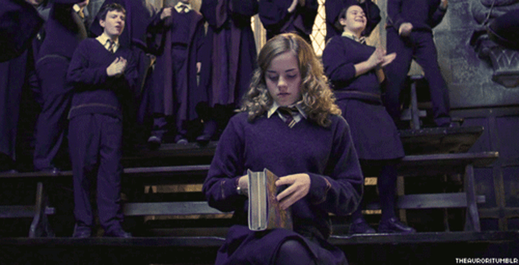 A gif of Hermione Granger opening a book