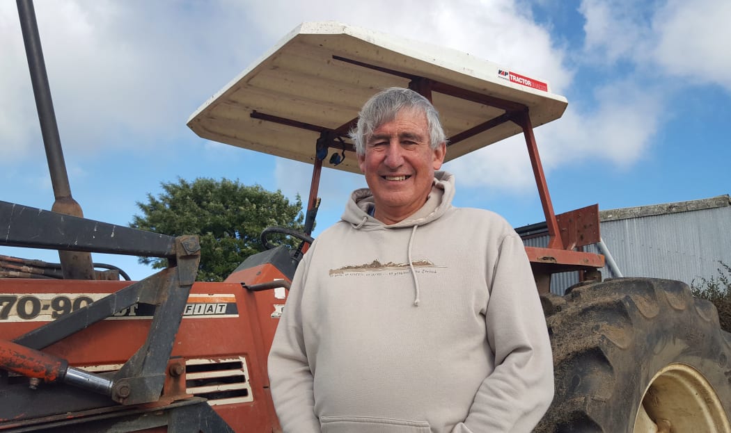 Farmer in front of his tractor