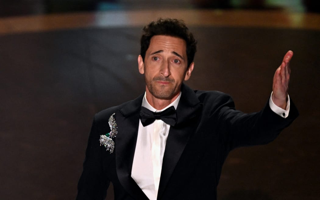 US actor Adrien Brody accepts the award for Best Actor in a Leading Role for "The Brutalist" during the 97th Annual Academy Awards at the Dolby Theatre in Hollywood, California on March 2, 2025. (Photo by Patrick T. Fallon / AFP)