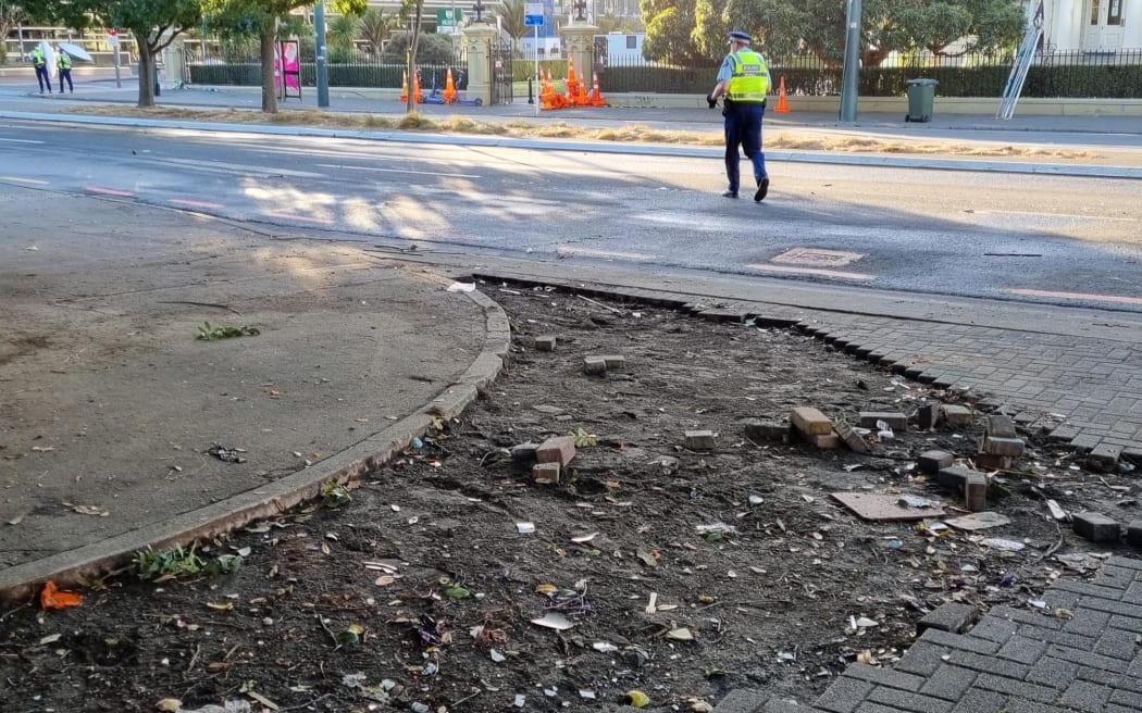 A ripped-up pavement outside Parliament is seen on 3 March, 2022, a day after the bricks were used as projectiles, which protesters hurled at police.