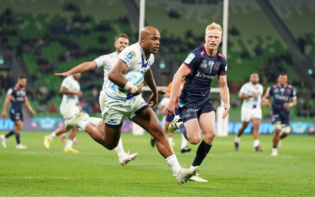 Mark Tele'a of the Blues scores a try during the Super Rugby Pacific Round 11 match between the Melbourne Rebels and the Blues in Melbourne, 2024.