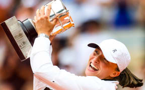 Iga SWIATEK (POL) holds the winners trophy after victory against Karolina MUCHOVA (CZE) on Philippe-CHATRIER court in the French Open Roland Garros 2023 women final.