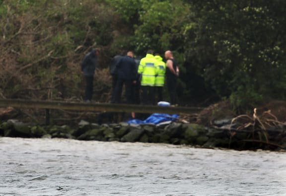 Divers searched the river where the body was found.