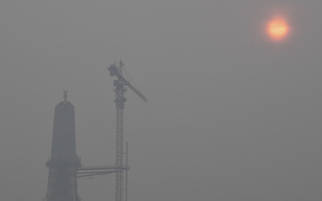The Signature Bridge over the Yamuna River is seen amidst heavy smog in New Delhi on October 29, 2019. (Photo by Prakash SINGH / AFP)