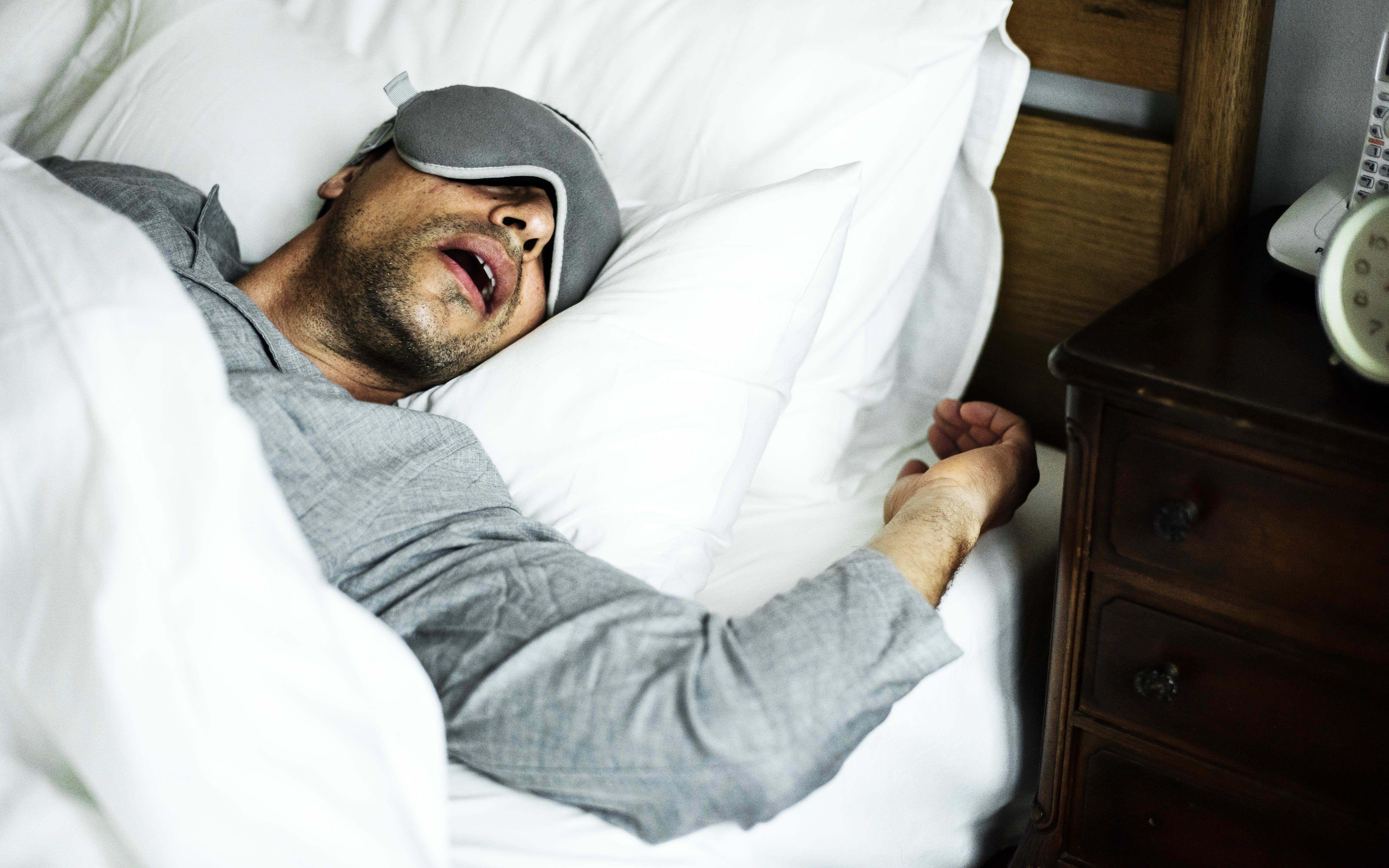 A man sleeping on a bed