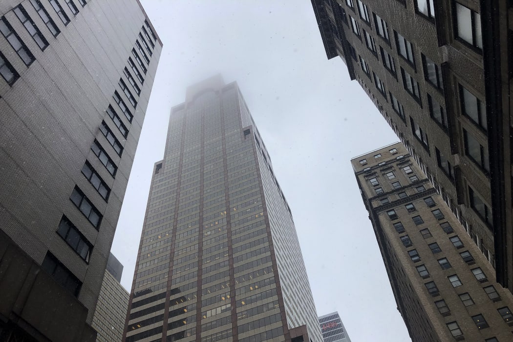 Mist and smoke cover the top of a building near 51st Street and 7th Avenue where a helicopter was reported to have crash landed on top of the roof of a building in midtown Manhattan.
