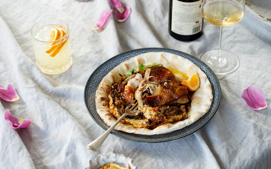 Palestinian roasted chicken with melted onions, hummus and lemony flatbread