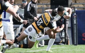 Fehi Fineanganofo of Bay of Plenty is tackled by Daniel Rona of Taranaki.