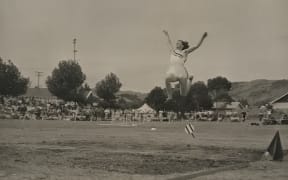 Yvette Corlett in mid-jump