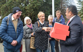 Kāpiti local MP Kris Faafoi met with residents, who were campaigning for a hospital, outside parliament on 13 June, 2018.