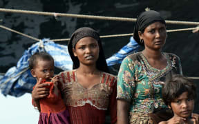 Rohingya migrants in a boat drifting in Thai waters off the southern island of Koh Lipe in the Andaman sea on May 14, 2015.