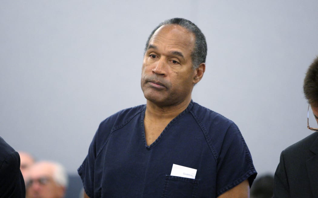 (FILES) O.J. Simpson stands during sentencing at the Clark County Regional Justice Center December 5, 2008 in Las Vegas, Nevada. Simpson and co-defendant Clarence "C.J." Stewart were sentenced on 12 charges, including felony kidnapping, armed robbery and conspiracy related to a 2007 confrontation with sports memorabilia dealers in a Las Vegas hotel.   Issac Brekken-Pool/Getty Images/AFP (Photo by Isaac BREKKEN / POOL / AFP)