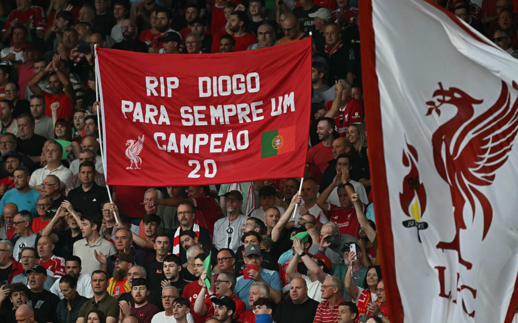 Liverpool's fans hold up a banner to pay tribute to late Portuguese forward Diogo Jota.