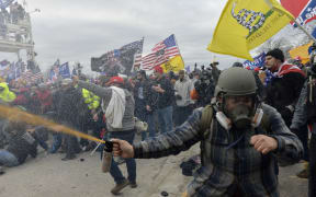 Trump supporters clash with police and security forces as people try to storm the US Capitol Building in Washington, DC, on January 6, 2021.