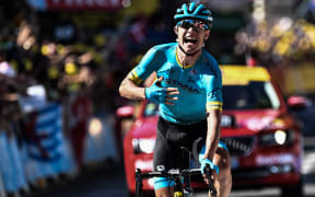 Denmark's Magnus Nielsen celebrates as he crosses the finish line to win the 15th stage of the Tour de France.