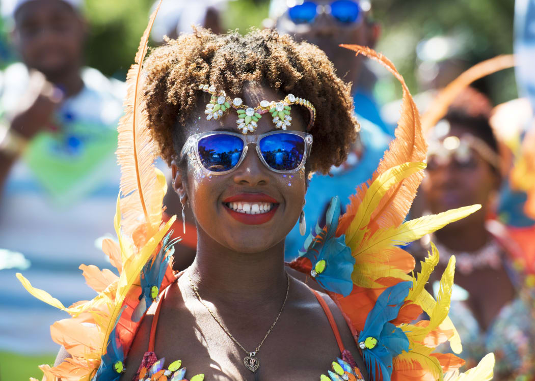 A dancer participates in National Heroes Day parade celebrations June 19, 2017 in St. David's, Bermuda, to honor those men and women who officially became National Heroes in Bermuda.