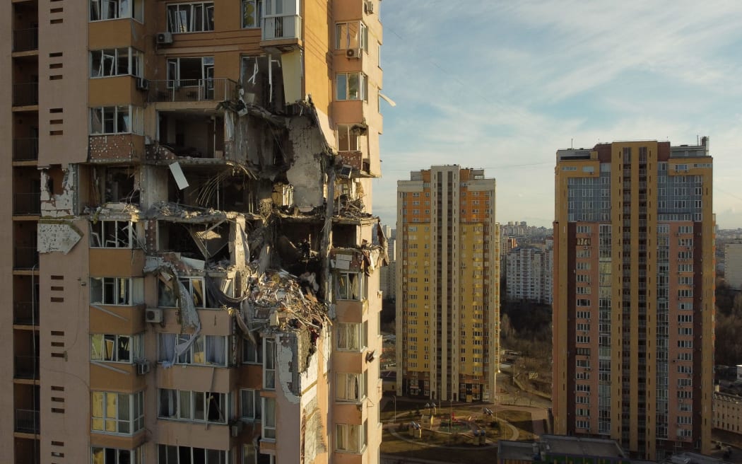 Damage to the upper floors of a building in Kyiv after it was reportedly struck by a Russian rocket.