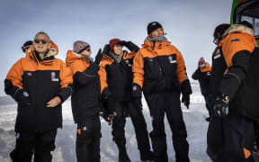 Prime Minister Jacinda Ardern and partner Clarke Gayford with Antarctica NZ chief executive Sarah Williamson, second left, and Antarctica NZ Board chairman Sir Brian Roche, far left, shortly after stepping off the plane on 26 October 2022.