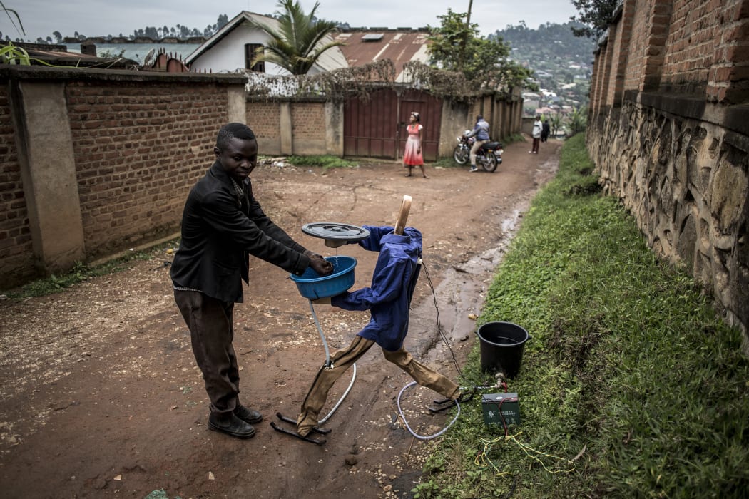 An automatic hand washing robot works to assist in the fight against Ebola. The ebola virus is spread through touch, and the use of the robot helps stop people from touching the same tap handles before and after washing their hands.