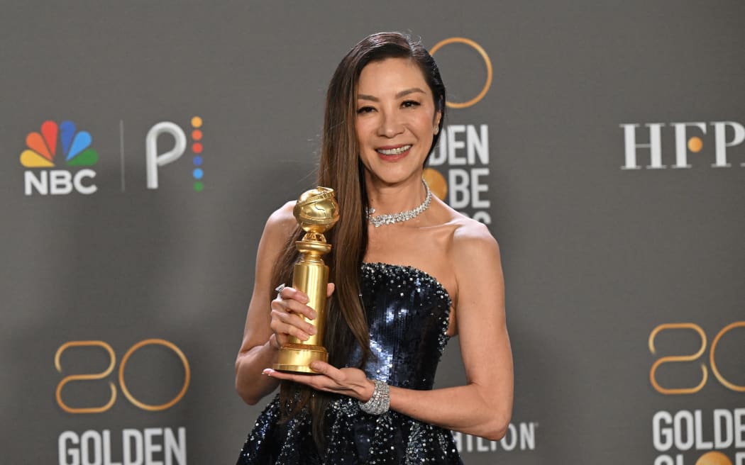 Malaysian actress Michelle Yeoh poses with the award for Best Actress - Motion Picture - Musical/Comedy for "Everything Everywhere All at Once" in the press room during the 80th annual Golden Globe Awards at The Beverly Hilton hotel in Beverly Hills, California, on January 10, 2023. (Photo by Frederic J. Brown / AFP)