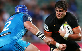 Tomas Lezana of the Jaguares charges James Parsons.