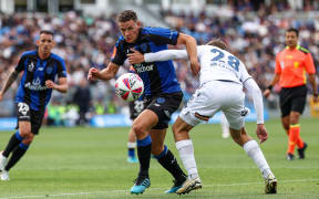 Auckland FC's Louis Verstraete and Melbourne Victory's Kasey Bos.