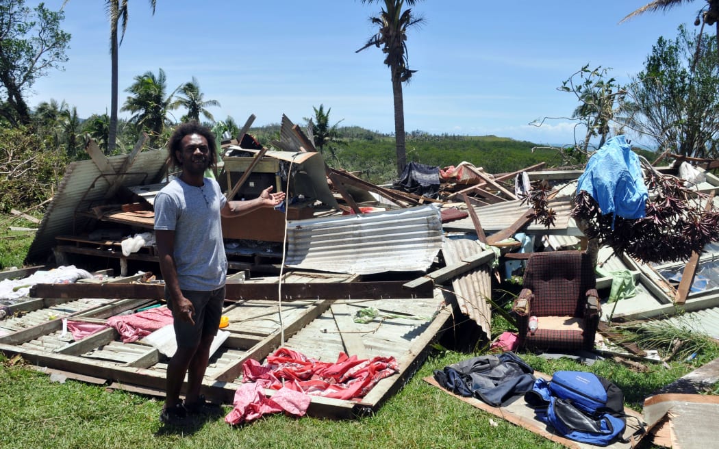 A resident stands in front of their destroyed house in Bua, Vanua Levu.