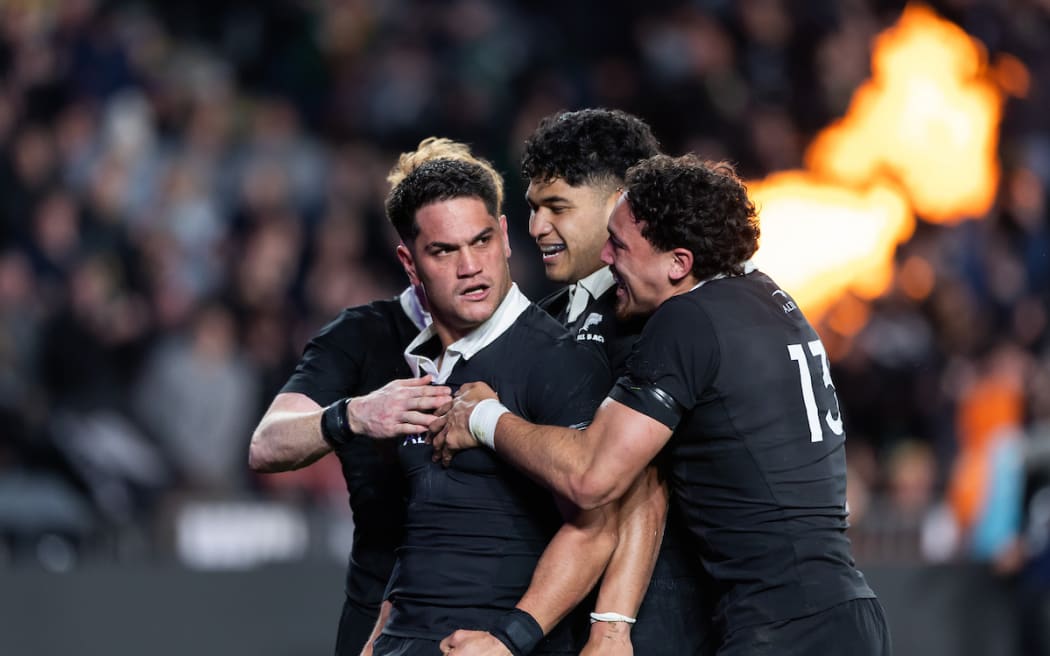 Quinn Tupaea celebrates.