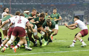 South Africa's hooker Marnus van der Merwe (C) prepares to dive across the line to score a try during the international rugby union Test match between South Africa and Georgia at Mbombela Stadium in Mbombela on July 19, 2025. (Photo by WIKUS DE WET / AFP)