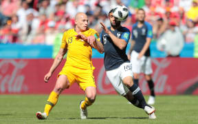 Australia midfielder Aaron Mooy battles for the ball against France's Nabil Fekir in their opening World Cup match.
