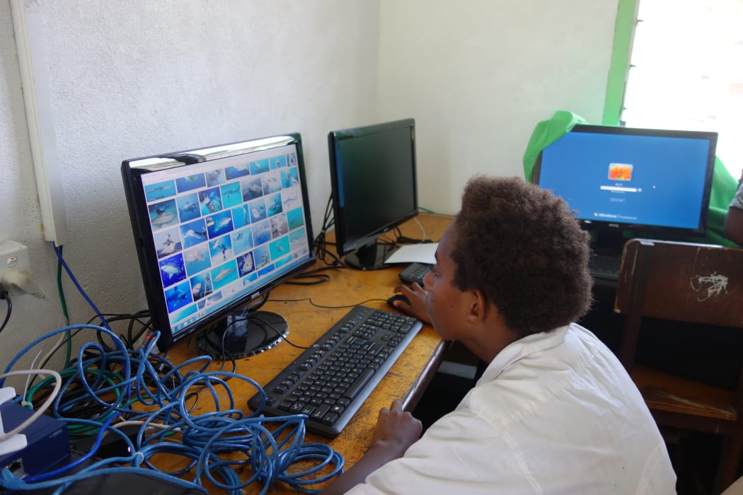 A Lambubu School student searches sharks on the newly internet connection.
