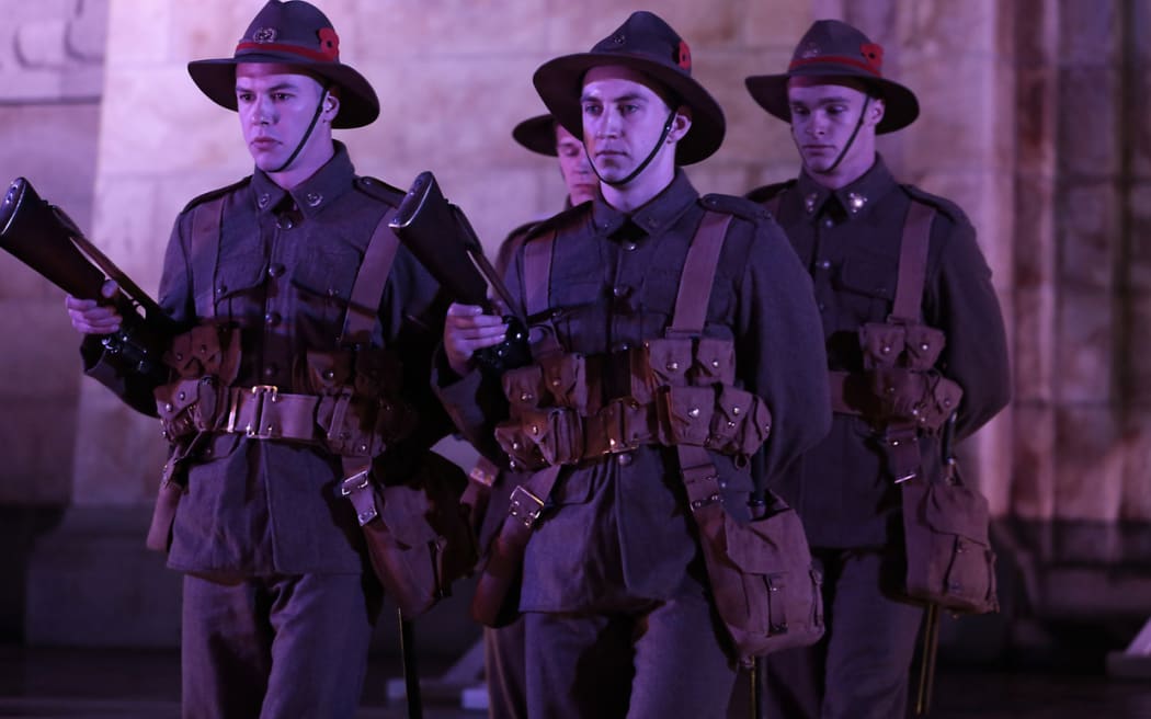 250414. Photo Diego Opatowski / RNZ. Troops in World War I uniforms marching on the Cenotaph in Wellington.