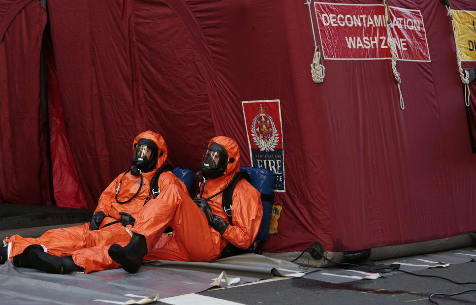 Officers in breathing apparatus worked at the decontamination tent.
