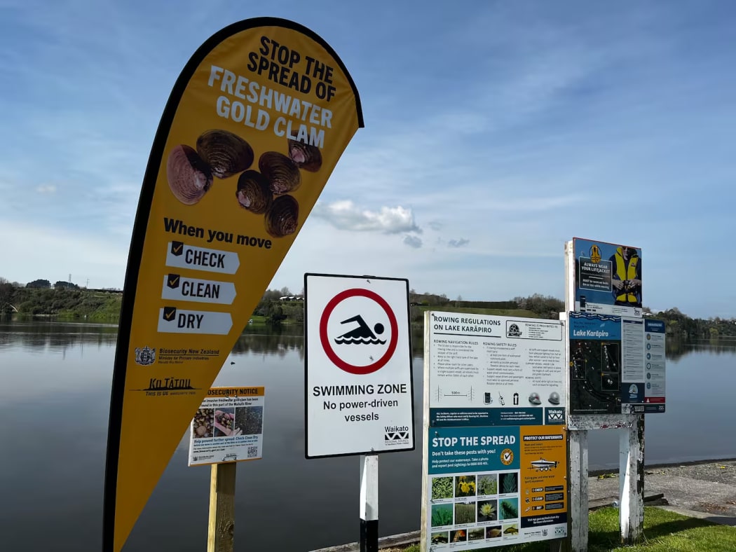 New signage at Lake Karāpiro to remind visitors to stop the spread of the freshwater gold clam.