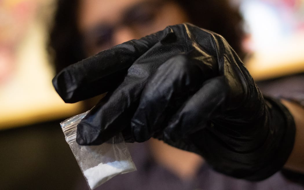 An NGO carrying out testing on drugs at an event - including this bag of cocaine, in Colombia, in 2021.