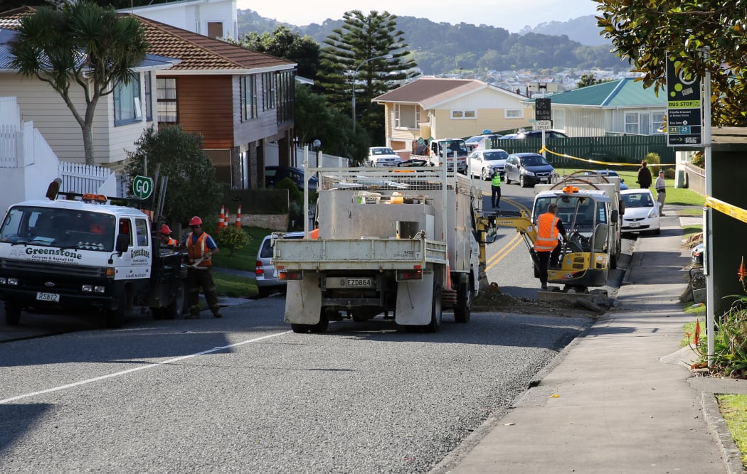 Workmen in Priscila Cres. working on pipes.
