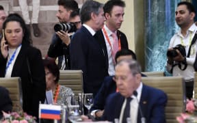 US Secretary of State Antony Blinken (top C) walks past Russian Foreign Minister Sergei Lavrov (lower) during the G20 foreign ministers' meeting in New Delhi on 2 March, 2023.