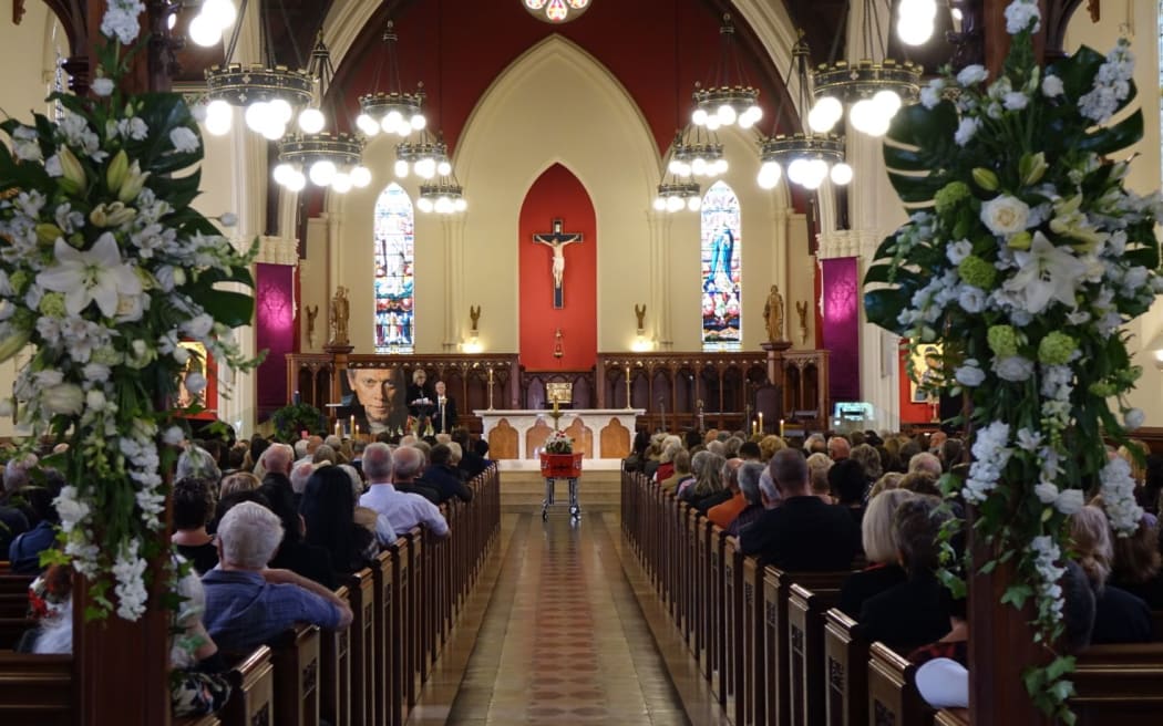 Hundreds of people gathered for the funeral of pop pioneer Ray Columbus.