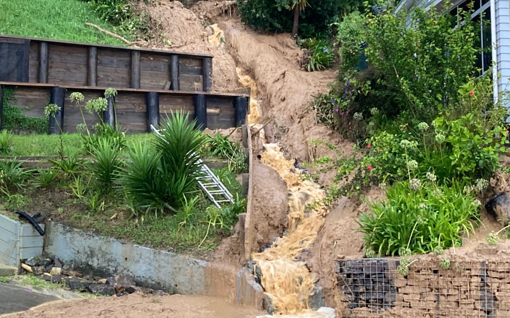 Cyclone Gabrielle caused flooding on Tararu Road and brought down much of the cliff mud.