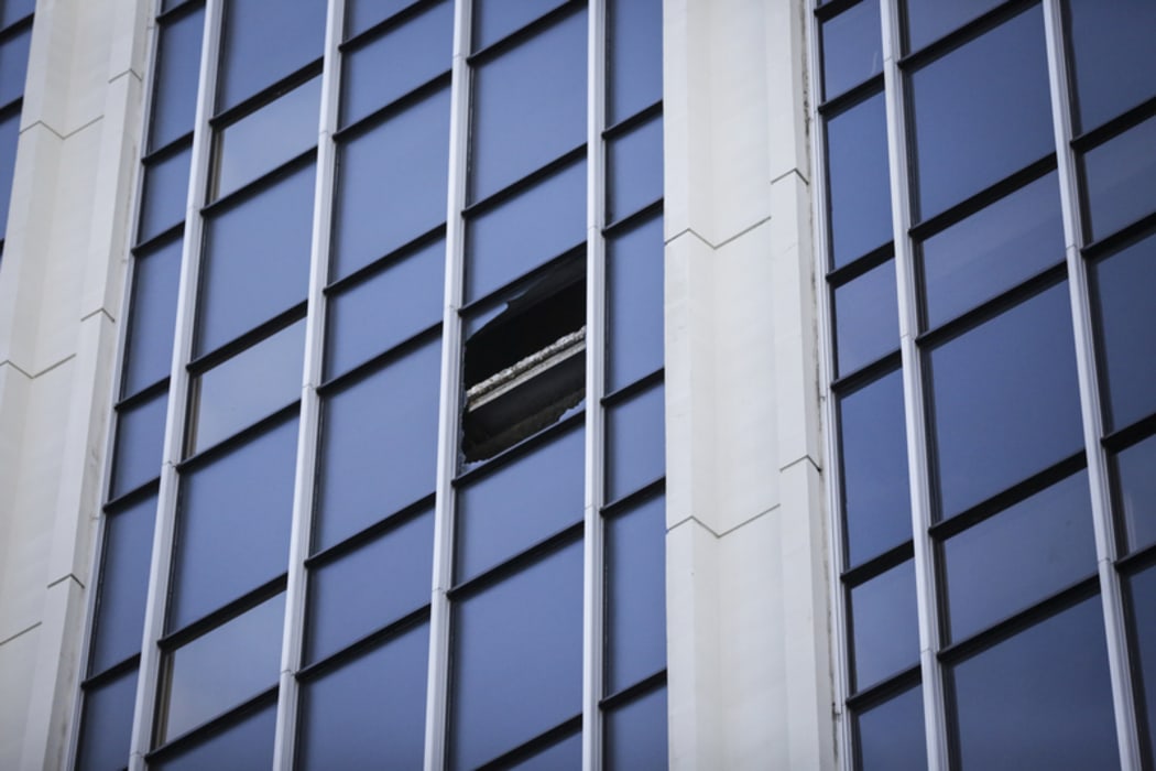 Pane of glass smashed from a window of a inner city building on The Terrace, Wellington