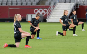 New Zealand players take a knee before New Zealand v Australia, Tokyo Olympics 2021.