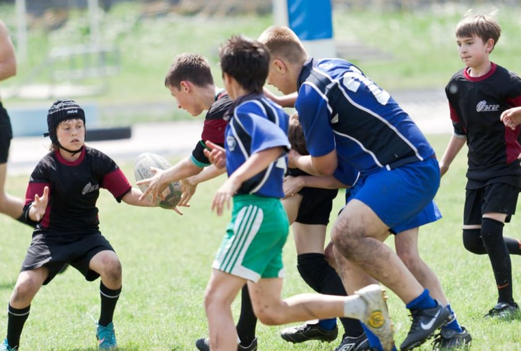 Children playing rugby
