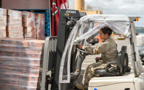 Goods being loaded onto the HMNZS Canterbury before it left for Port Vila.