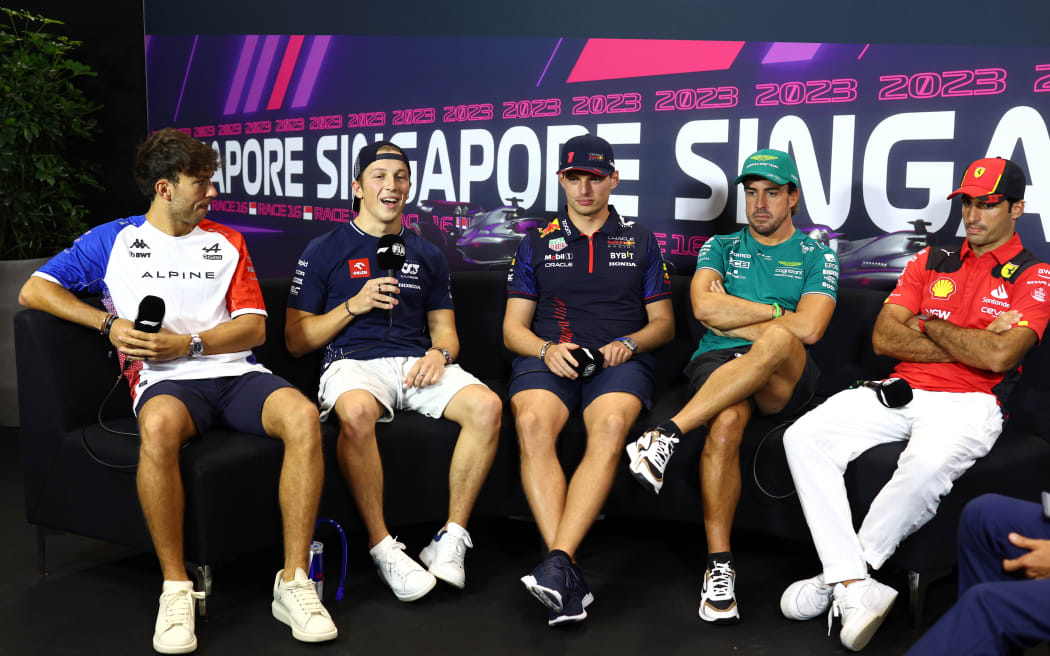 Pierre Gasly of France and Alpine F1, Liam Lawson of New Zealand and Scuderia AlphaTauri, Max Verstappen of the Netherlands and Oracle Red Bull Racing, Fernando Alonso of Spain and Aston Martin F1 Team and Carlos Sainz of Spain and Ferrari attend the Drivers Press Conference during previews ahead of the F1 Grand Prix of Singapore.
