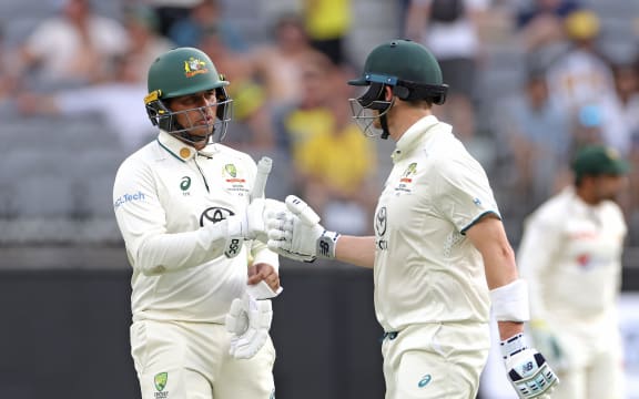 Usman Khawaja and Steve Smith of Australia leave the field at stumps on Day 3 of the first Test match between Australia and Pakistan at Optus Stadium in Perth, Saturday, December 16, 2023. (AAP Image/Richard Wainwright / www.photosport.nz)