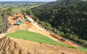 Excavators at work on the ridgeline above Kauri Tree Corner, where two fresh slips stymied plans to reopen State Highway 1 over the Brynderwyns this week.
