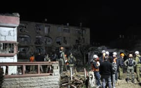This frame grab from AFPTV footage shows damage to building in the town of Dimona on March 21, 2026. An Iranian missile on March 21, hit the Israeli town of Dimona, home to a nuclear facility, in what the Islamic republic said was retaliation for strikes on its own nuclear site at Natanz. Dimona hosts a facility just outside the main town widely believed to possess the Middle East's sole nuclear arsenal, although Israel has never admitted to possessing nuclear weapons. (Photo by Jorge NOVOMINSKY / AFPTV / AFP) /