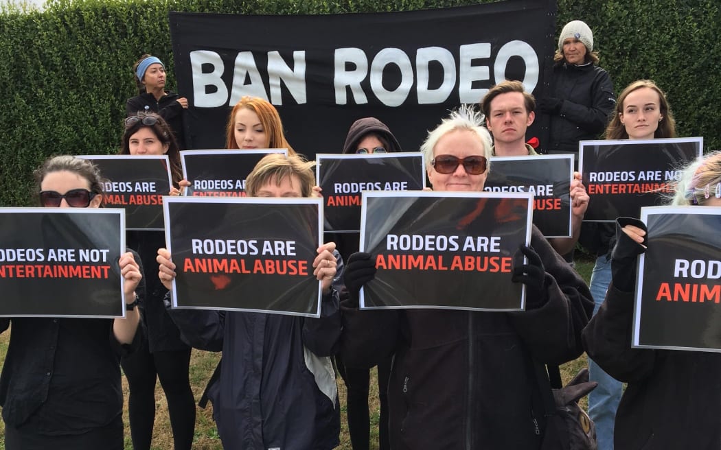Protesters call for a ban on rodeo.